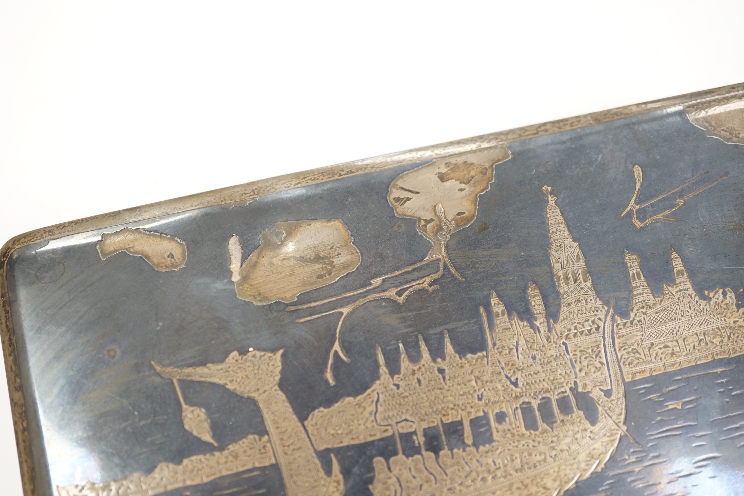 A Thai white metal and niello cigarette box, 18cm.